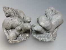 Two painted composition garden figures of otters