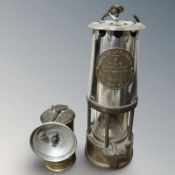 An Eccles Protector Type 6 brass and chrome miner's lamp and a Premiere bike lamp.