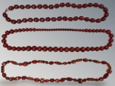 Three cherry amber-coloured/Bakelite beaded necklaces.
