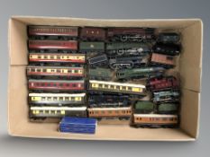 A quantity of die cast locomotives, carriages and other rolling stock.