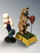 A novelty cast iron boxing dog, height 18 cm, and a further figure of Popeye.