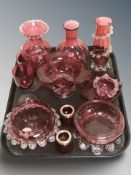 A group of cranberry glass including vases, drinking glasses, bowls, etc.