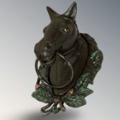 A cast iron towel holder in the form of a horse, height 29 cm.