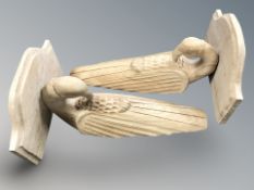 A pair of carved pine wall brackets in the form of birds,
