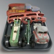 A tin plate model of a tractor, truck, artillery piece, delivery wagon.