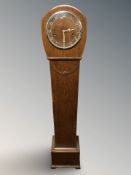 An Art Deco oak granddaughter clock, height 132 cm.