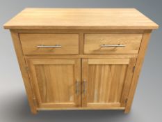 A modern oak side cabinet, 92 cm x 46 cm x 83 cm.