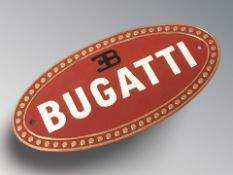 A cast iron Bugatti plaque, width 35 cm.