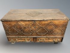 A George III and later carved oak blanket chest, 123 cm x 58 cm x 63 cm.