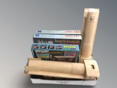 A group of scale modelling kits, two matchstick model locomotives.