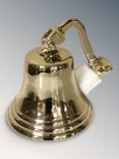 A brass coated aluminium ship's style bell, height 19 cm including fitting.