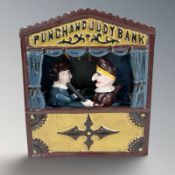 A cast iron Punch and Judy money bank, height 18 cm.