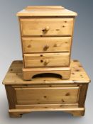A modern pine blanket box and a three drawer bedside stand.