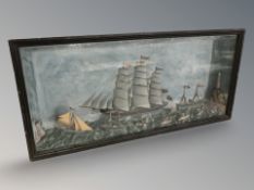 An early 20th century ebonised and glazed montage of sailing ships,