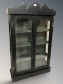A Victorian ebonised and glazed double door display cabinet,