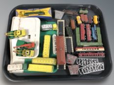 A miniature garage and group of Lesney die cast buses, tin plate rolling stock,