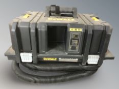 A DeWalt 54 v dust extractor, with remote.