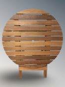 A teak folding garden patio table, diameter 90 cm.