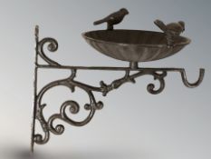 A cast iron bird bath wall bracket, length 36 cm.