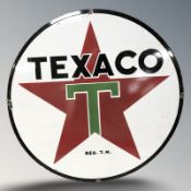 An enameled metal Texaco sign, diameter 76 cm.