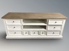 A painted pine low sideboard, fitted drawers and shelves, 160 cm x 46 cm x 66 cm.