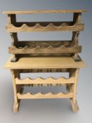 Two oak bottle rack stools, largest 64 cm wide.