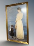 After S Skagen : Lady standing by a labrador at the coast, colour print, 52 cm x 89 cm.
