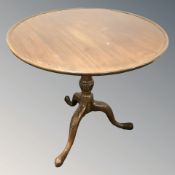 A George III style mahogany circular tripod table,