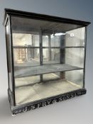 An early 20th century ebonised and carved J S Fry & Sons Limited glazed shop counter display