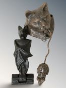 A cast metal door knocker in the form of a cat holding a mouse, length 23 cm,