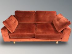 A modern Scandinavian style three seater settee, 183 cm L x 100 cm D x 71 cm H.