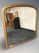 An early 20th century gilt over mantel mirror, 117 cm W x 116 cm H.