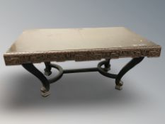 A Chinese carved and lacquered dining table,