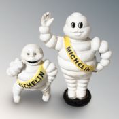 Two cast iron Michelin man figures, tallest 22 cm.