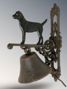 A cast iron labrador bell on wall bracket, height 33 cm.