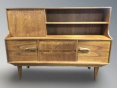 A 20th century teak inverted bow front sideboard, 166 cm x 45 cm x 122 cm.