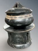 An African hard wood lidded bowl on stand,