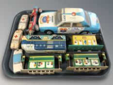 A Spanish tin plate police car, further rolling stock, Tri-Ang race car, etc.
