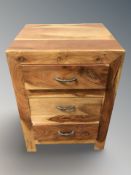 A mango wood three drawer chest, 50 cm x 46 cm x 71 cm.