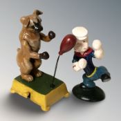 A novelty cast iron boxing dog, height 18 cm, and a further figure of Popeye.