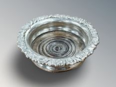 A Victorian silver bottle coaster, London 1897,