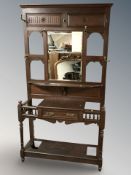 An oak mirror back hall stand, 112 cm x 36 cm x 210 cm.