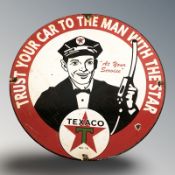 An enameled metal Texaco sign, diameter 30 cm.