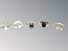 A 9ct gold opal ring, another with solitaire sapphire, further garnet ring,