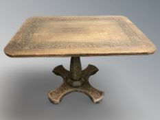 A carved oak rectangular tilt top breakfast table,
