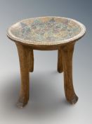 An African hard wood four-legged bead work stool,