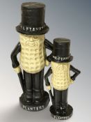 Two cast iron Mister Peanut figures, tallest 26 cm.