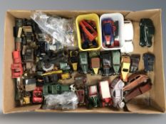 A group of hand made wooden miniature models of cars, die cast cars, etc.