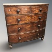 A Victorian mahogany bow-front five drawer chest,
