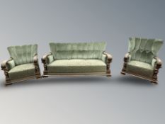 A continental Edwardian oak framed three piece suite,